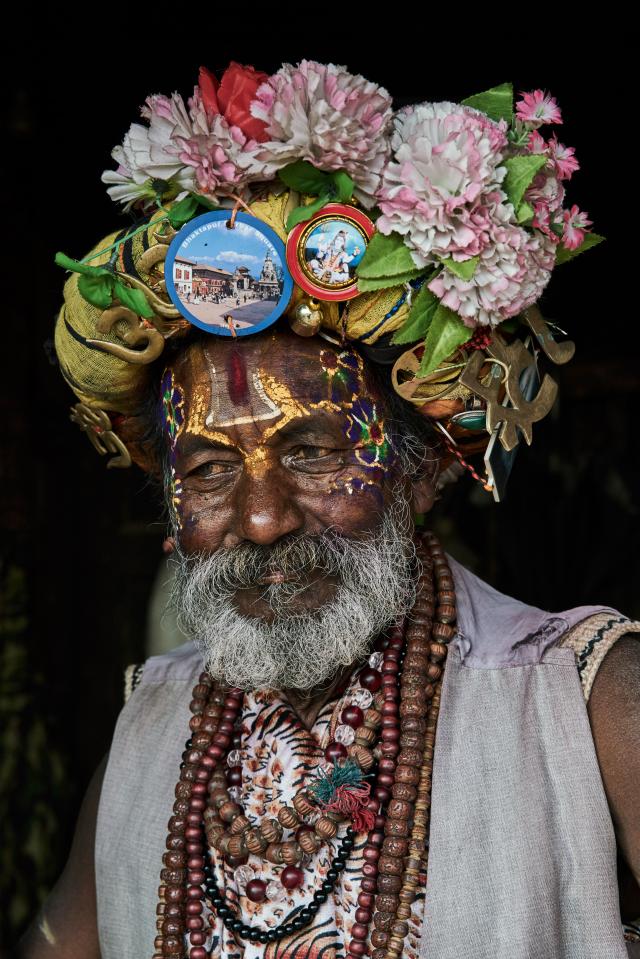  A holy man with a decorative face and headdress, taken in Kathmandu