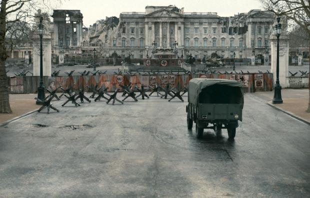 Buckingham Palace is shown crumbling and adorned with Swastikas