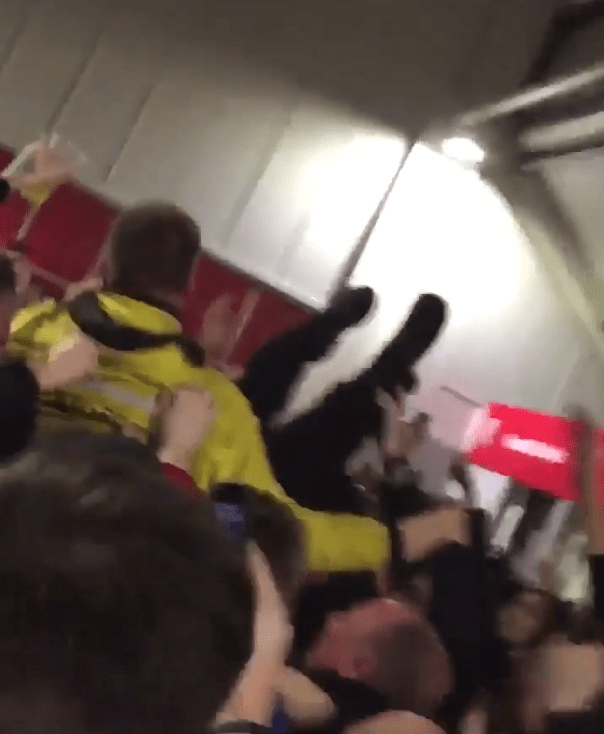  The steward is bounced up and down by jubilant Wolves fans