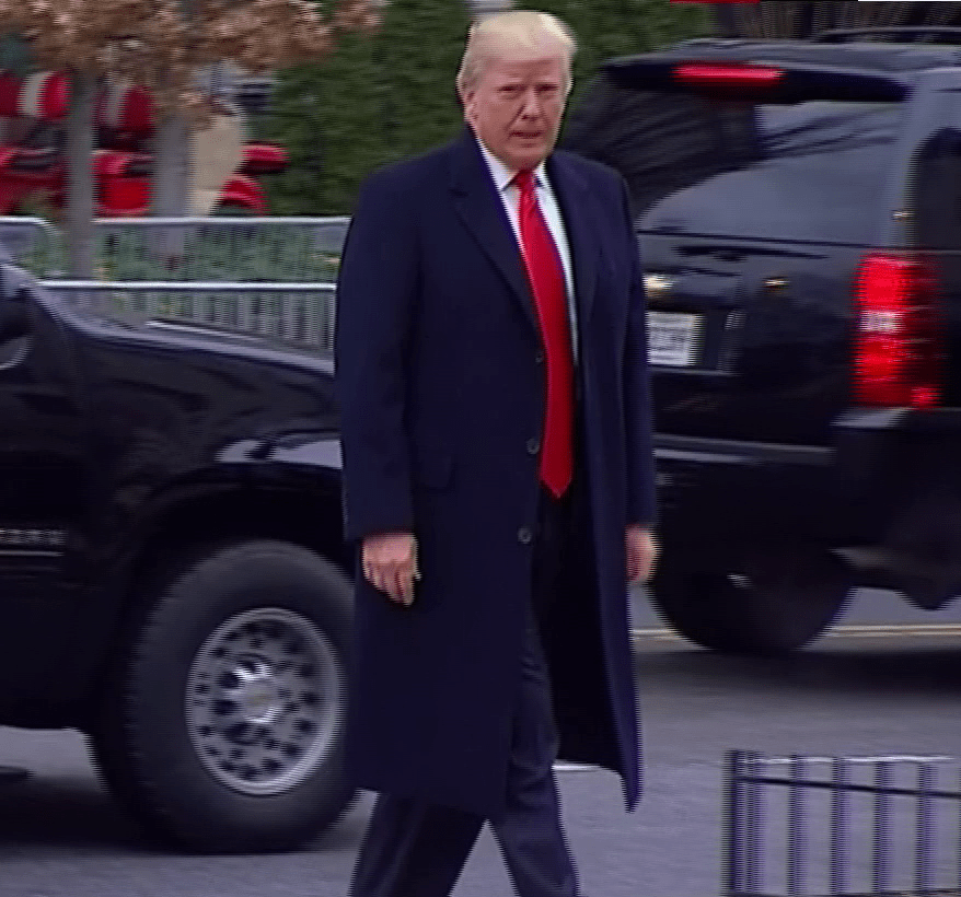  Trump was seen wearing a dark coat, smart shirt and red tie