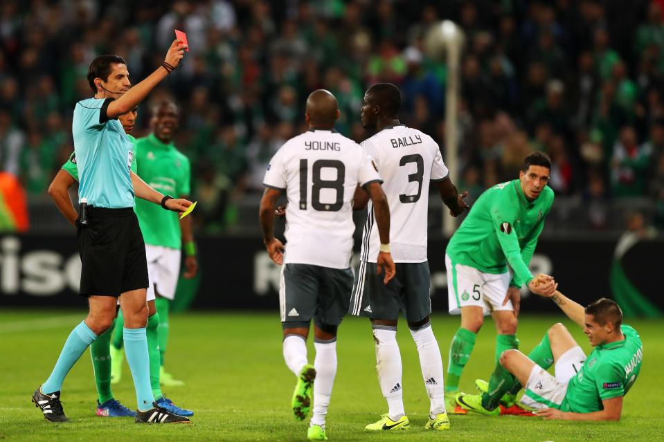  Manchester United's players could not believe it as Eric Bailly was sent off for a second yellow card in three minutes