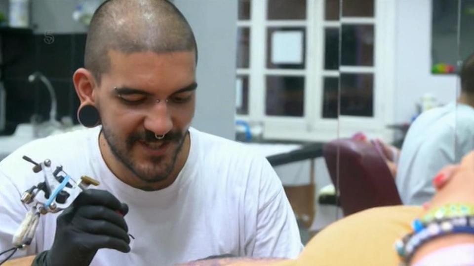  The tattoo designer grinned as he said she was his perfect customer