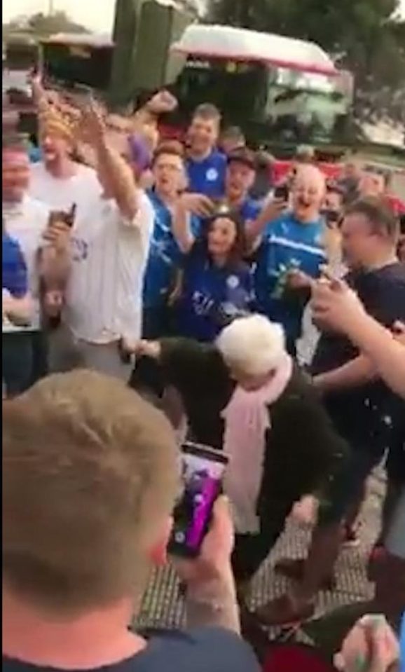  The supporters gathered round as the elderly woman showed off her moves