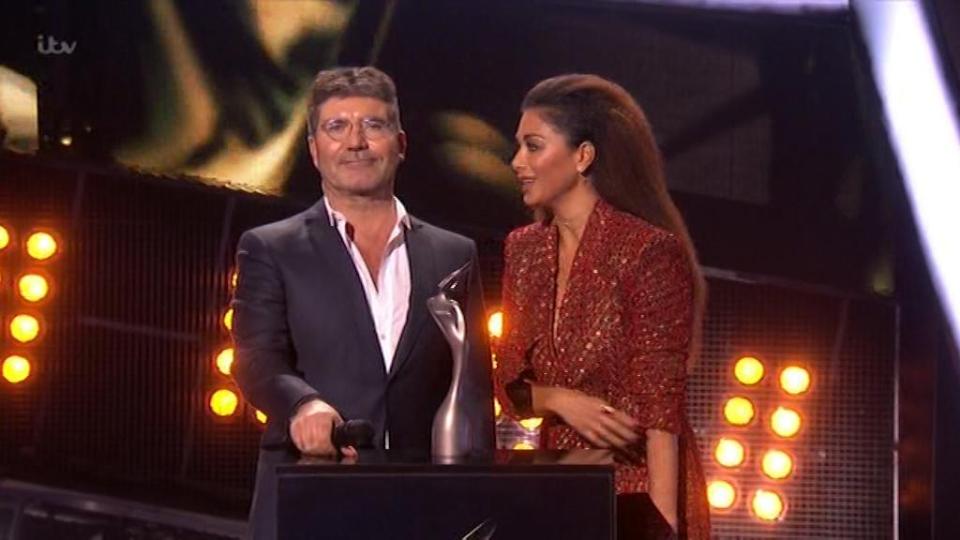  Simon Cowell hogged the mic as he took to the stage with Nicole Scherzinger