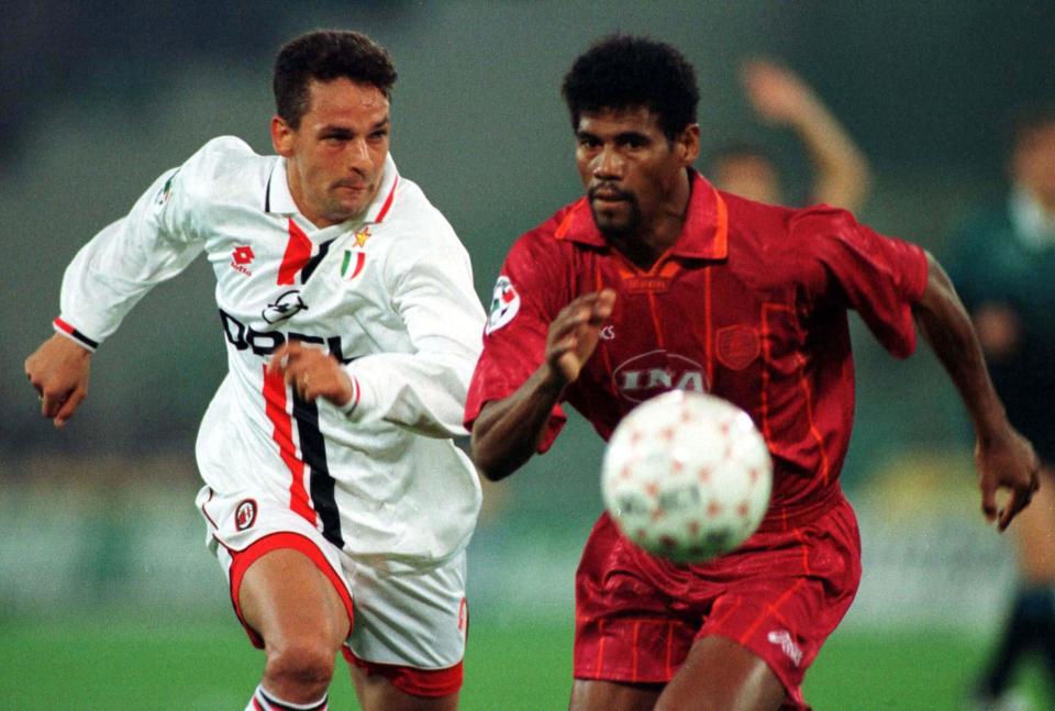  Roberto Baggio fights for the ball with Roma defender Aldair while at Milan