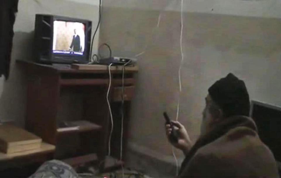 Osama Bin Laden watching the box in his secret compound 