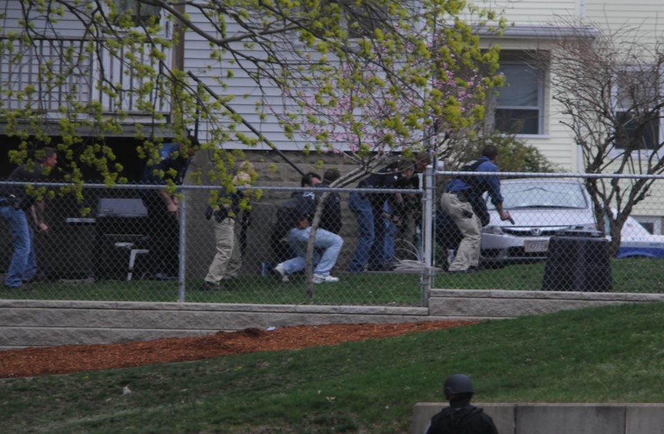 Cops approach the scene of the shoot-out