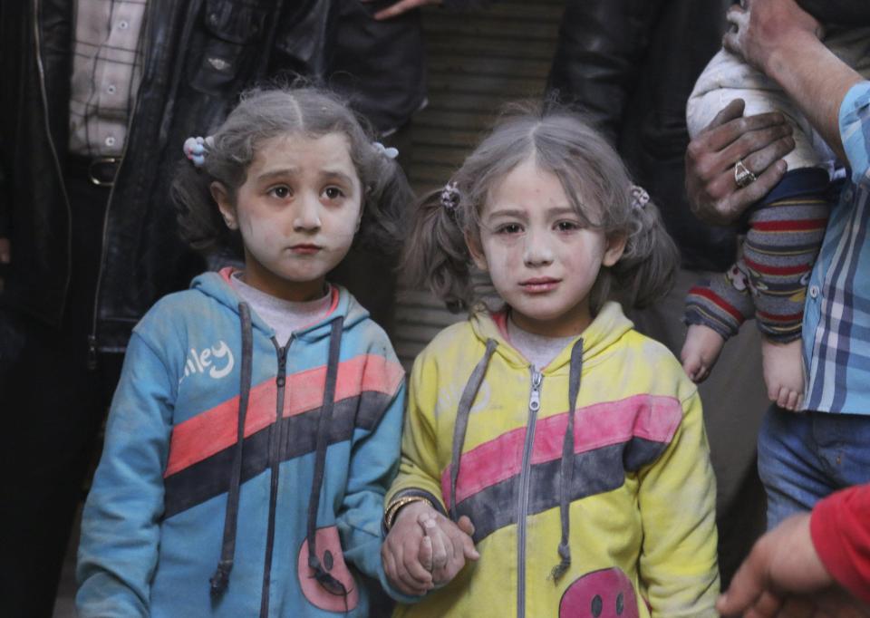  Girls who survived what activists said was a ground-to-ground missile attack by forces of Syria's President Bashar al-Assad