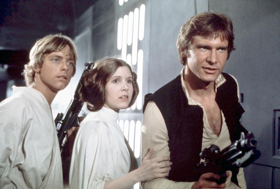  Harrison Ford with stars Mark Hamill and the late Carrie Fisher on the set of Star Wars: Episode IV - A New Hope