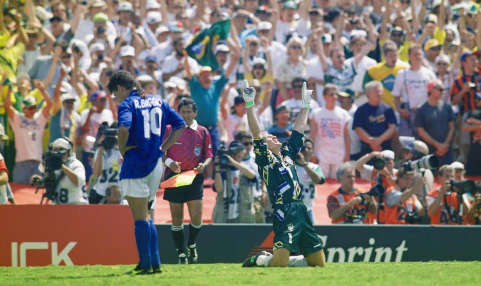  Roberto Baggio looks down as Claudio Taffarel celebrates following miss