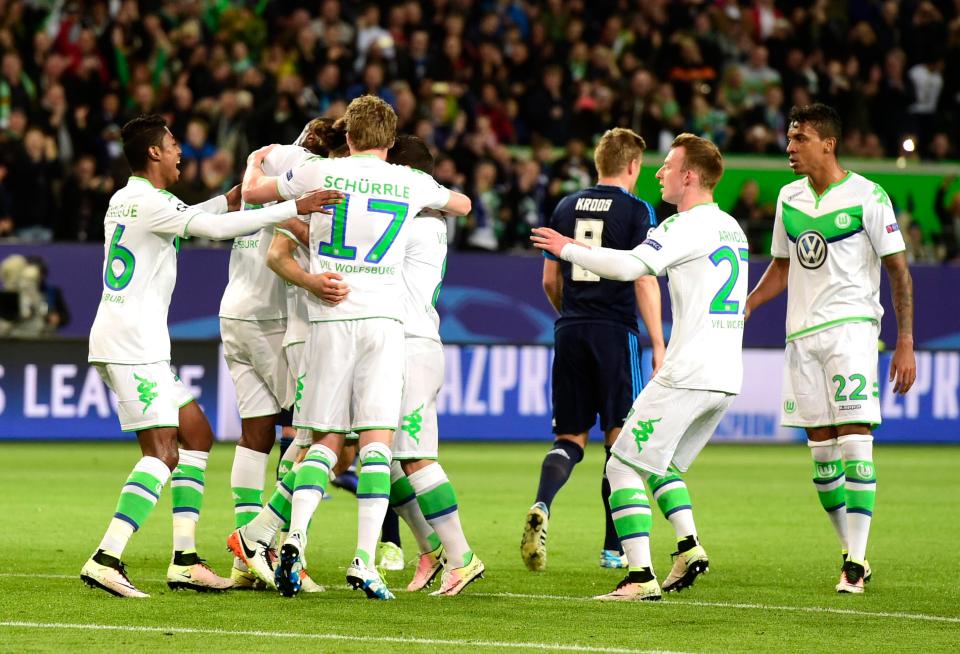  Wolfsburg players celebrate after taking 2-0 lead against Real Madrid