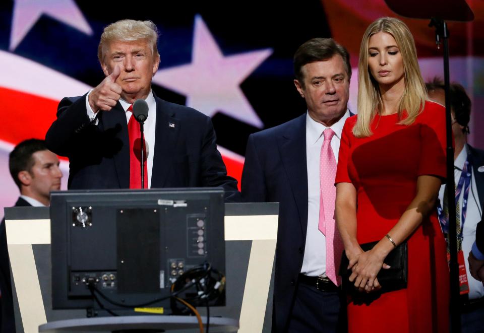  Manafort, seen behind Trump and his daughter Ivanka, was sacked after his ties to Russia through his work as an adviser in Ukraine were revealed