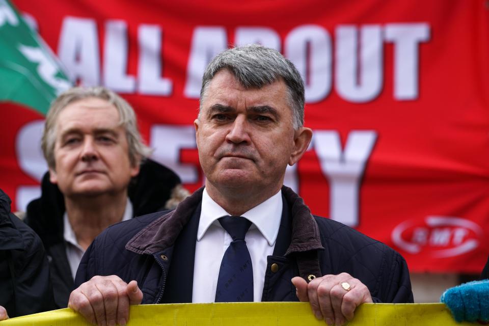  RMT Union Chief Nick Cash holds sign at national protest