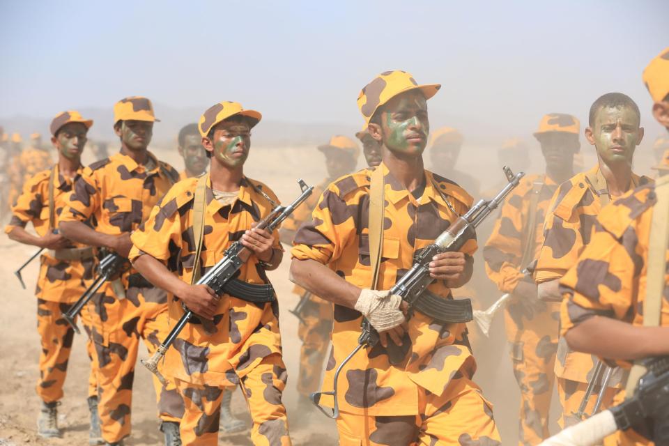  Newly recruited pro-government policemen parade during their graduation ceremony in the northern province of Marib, Yemen, ready to fight in the civil war