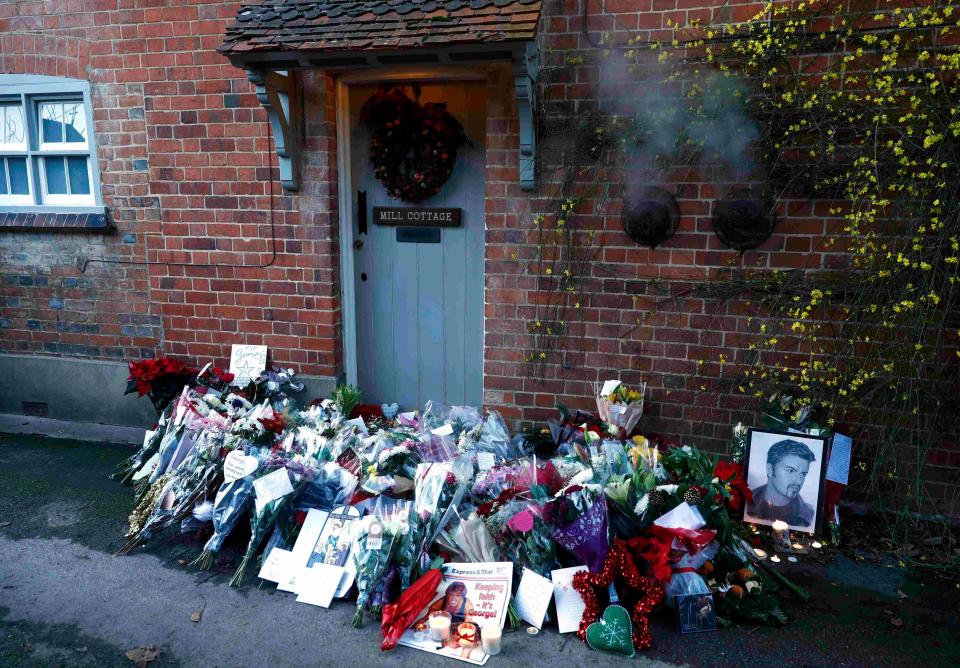  Tributes are laid outside George's home in Goring