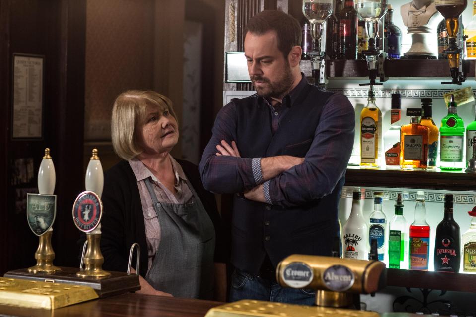  Danny Dyer as landlord Mick Carter standing next to co-star Annette Badland who plays Aunt Babe in the soap