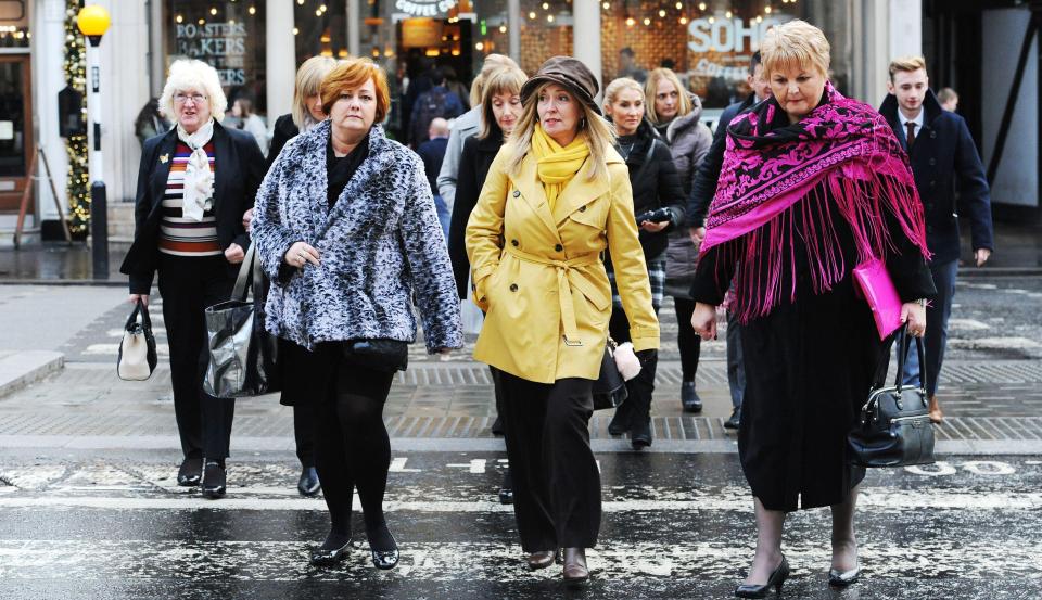  Relatives of the victims arrive at the Royal Courts of Justice in London for the inquest