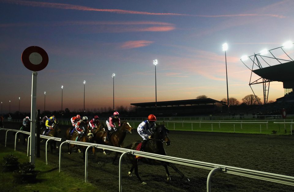  Runners and riders on their first lap in the Matchbook Traders Conference Handicap Stakes at Kempton Park