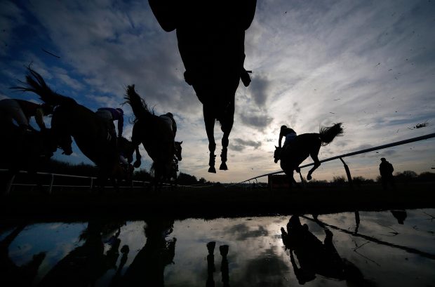 Runners clear the water jump at Leicester racecourse