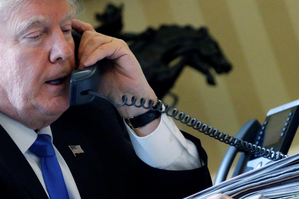  Trump, seen here calling Putin on 28 January, has consistently denied links to Russia