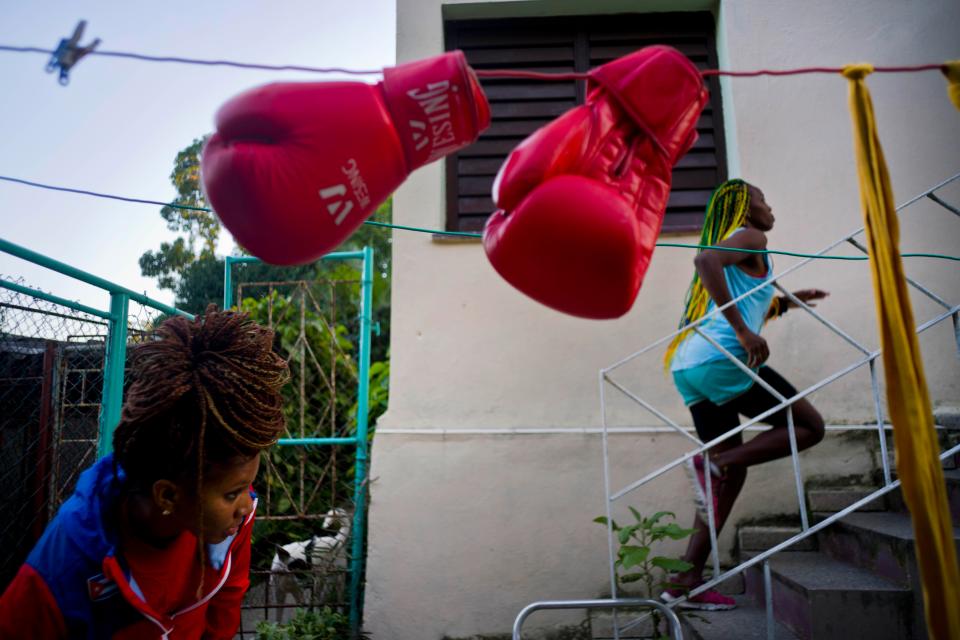  Boxer Legnis Cala runs up a flight of stairs in the backyard of her house, in Havana, Cuba.