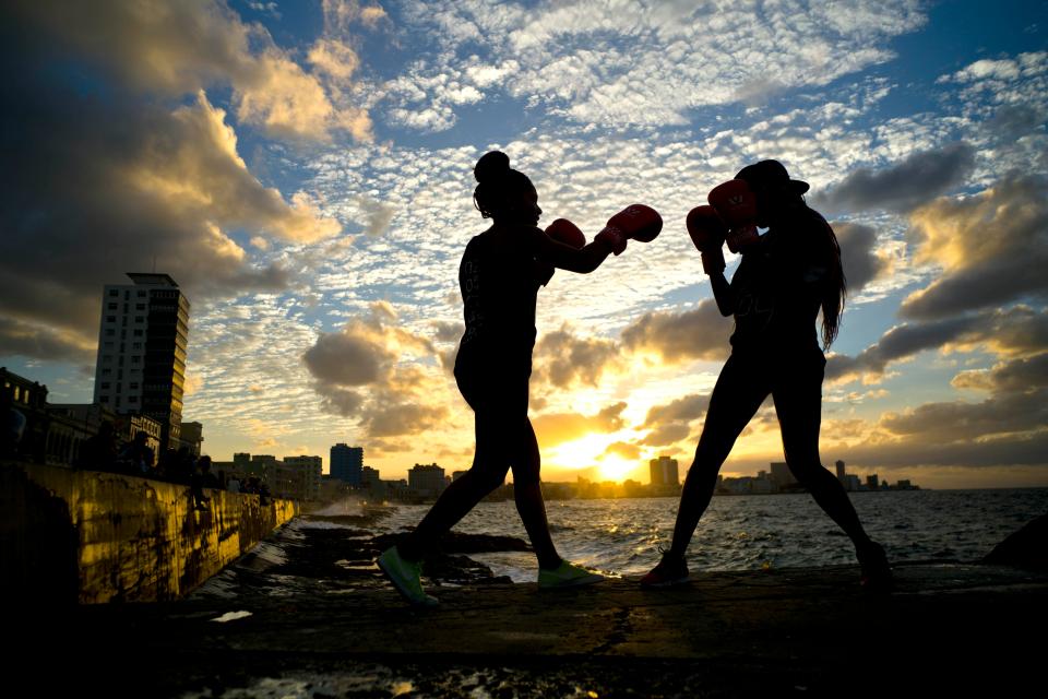  Idamerys Moreno, left, and Legnis Cala, train on Havana's sea wall, in Cuba