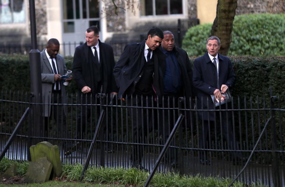  Ex-colleagues of Taylor leave the church after the service