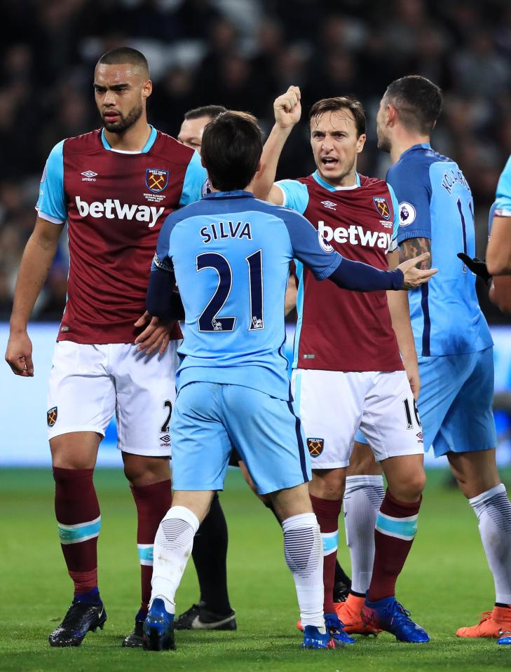  Mark Noble confronts David Silva in a rare display of fight from West Ham