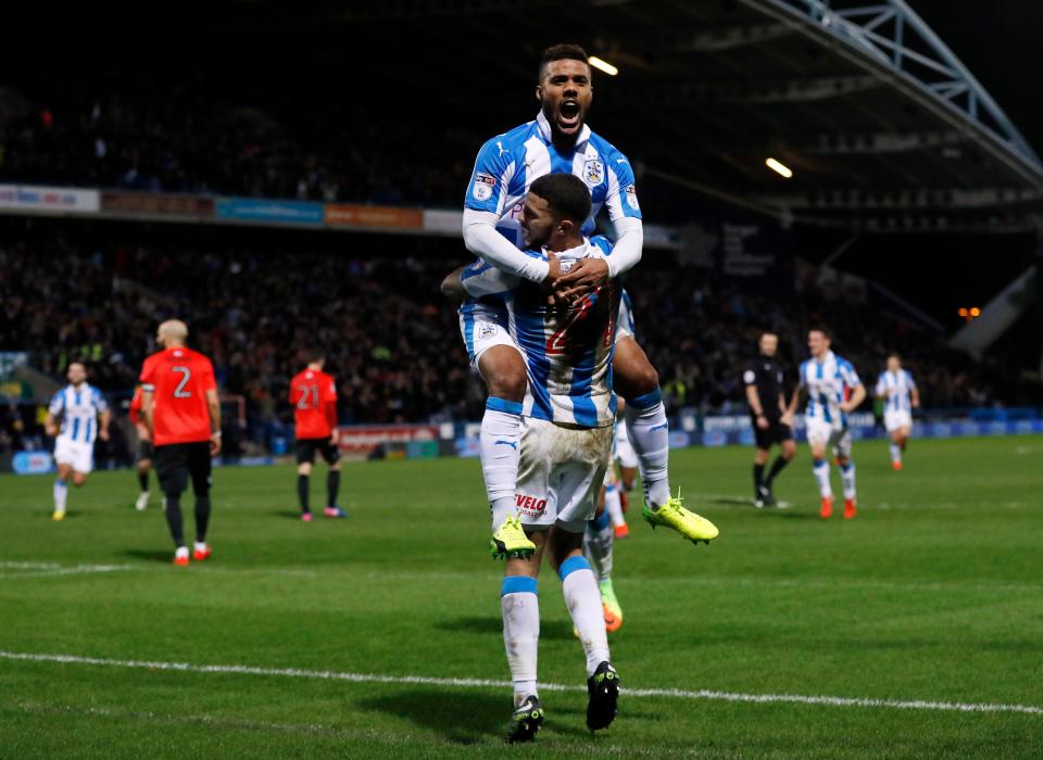  Elias Kachunga celebrates his goal and Hudderfield's third to take the game beyond Brighton