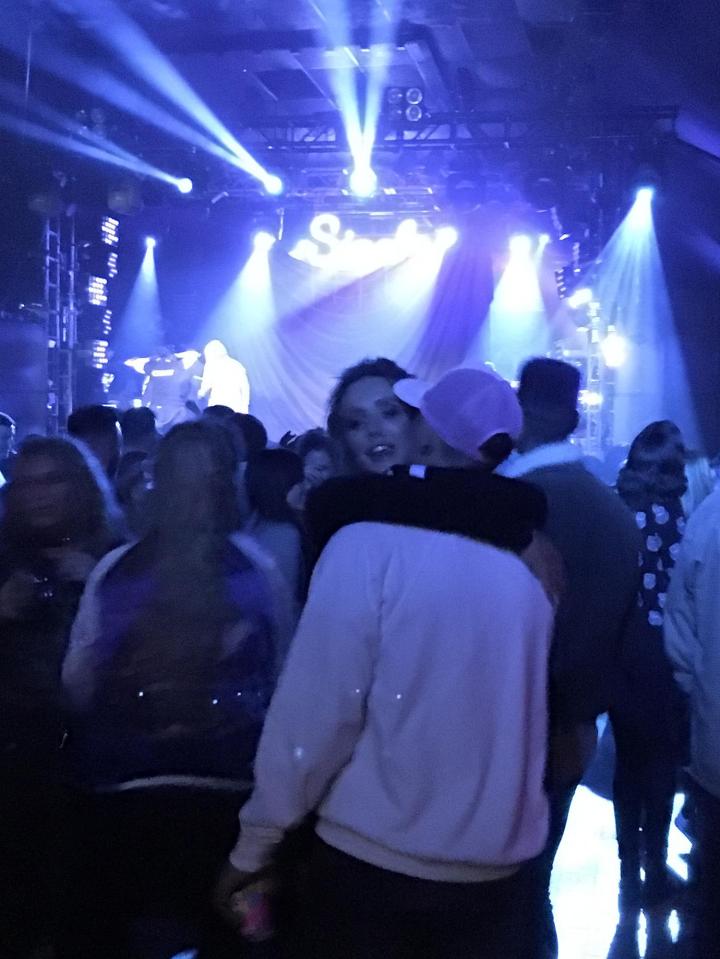  Charlotte grinned while hugging Bear after kissing him during a set from Sigala