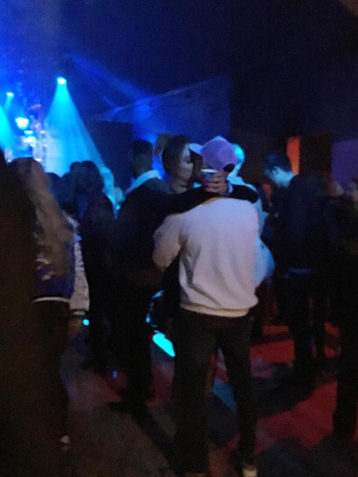  The couple didn't seem to care who was watching as they embraced in the middle of the busy concert