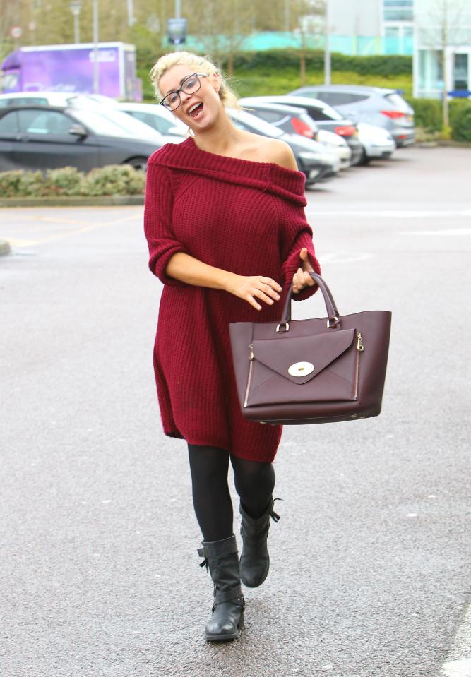  The TV beauty wore a snug-looking red jumper dress