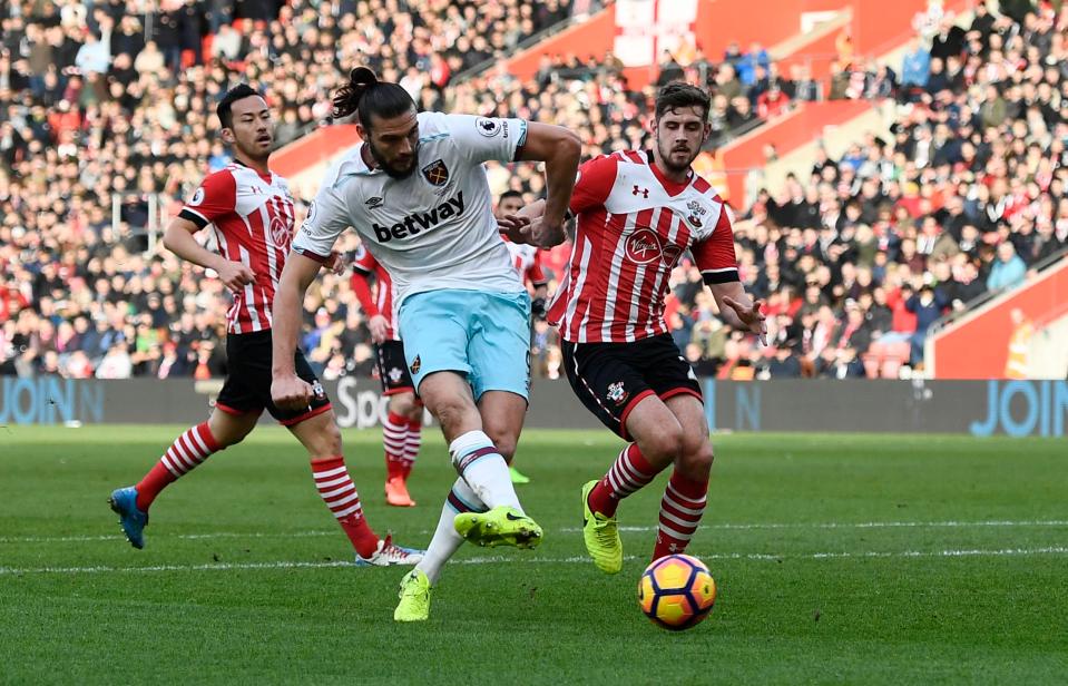  Andy Carroll calmly slots home past Fraser Forster to level the scores for West Ham