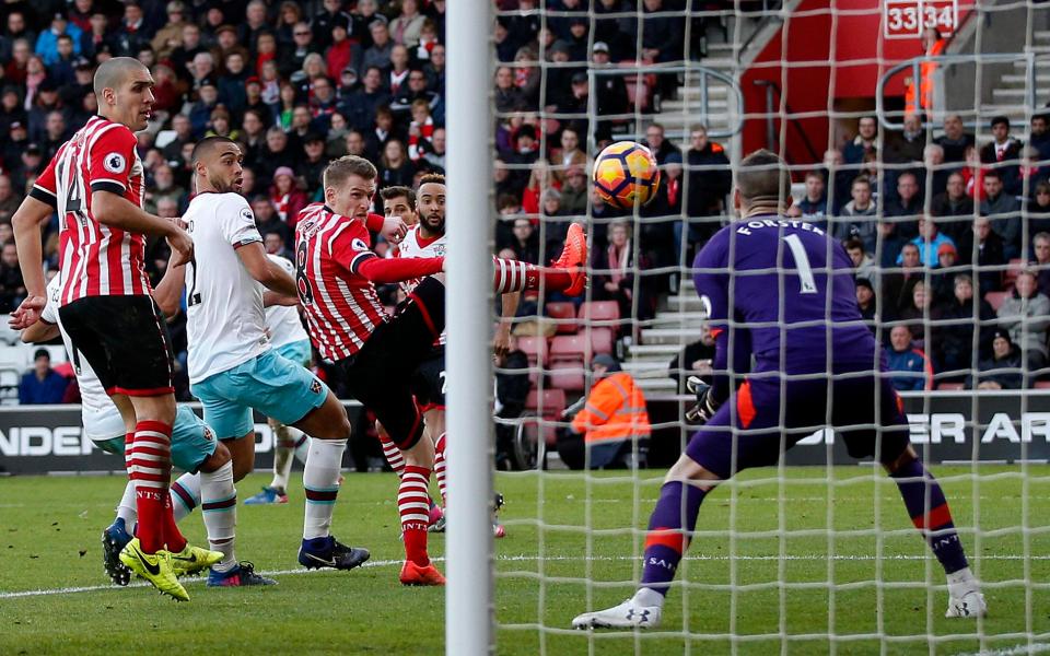  Steven Davis deflects a Mark Noble free-kick past Fraser Forster as West Ham score a third