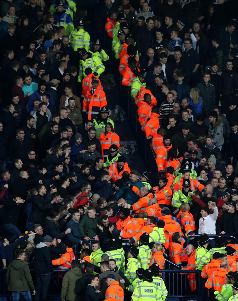  Stewards forged a barrier between the rowdy supporters