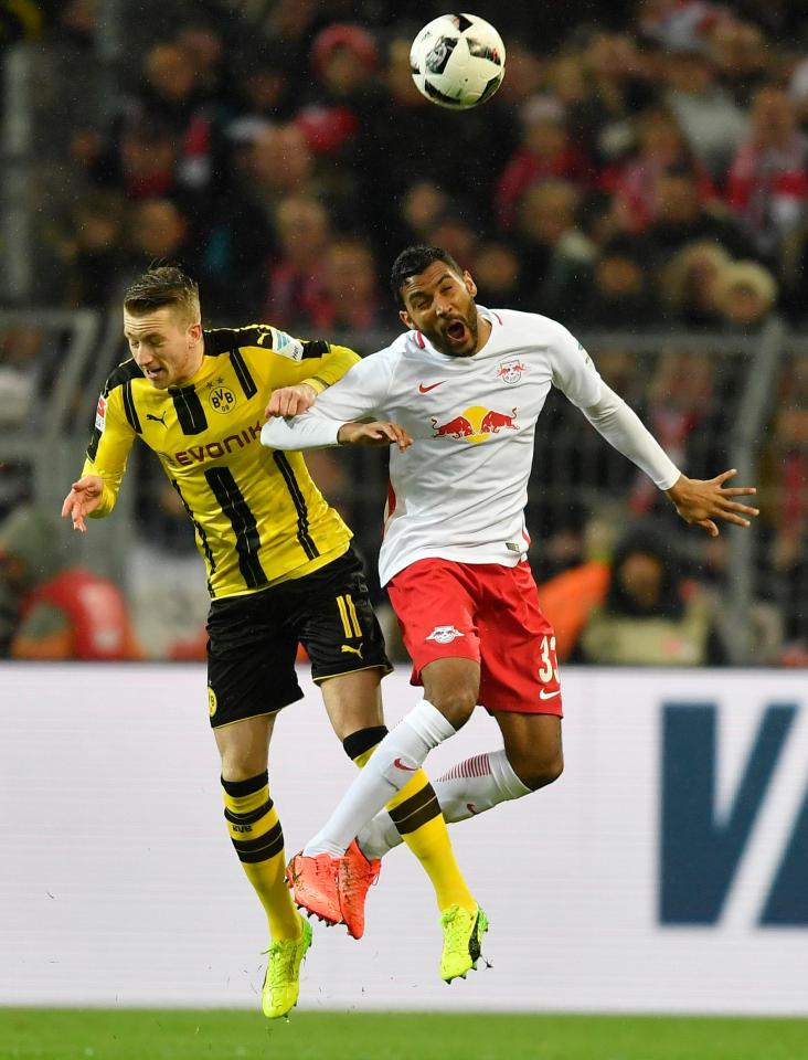  Dortmund's Marco Reus battles for the ball against RB Leipzig