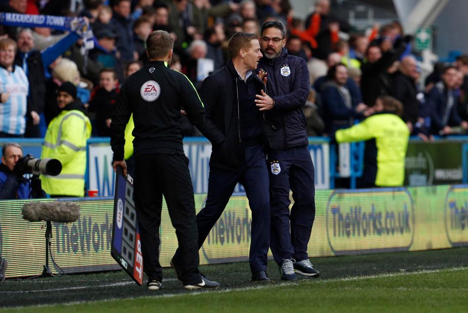  On his way back to his technical area Monk nudged the Huddersfield boss