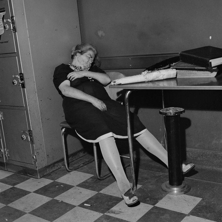  An elderly member of staff takes a nap in the station office