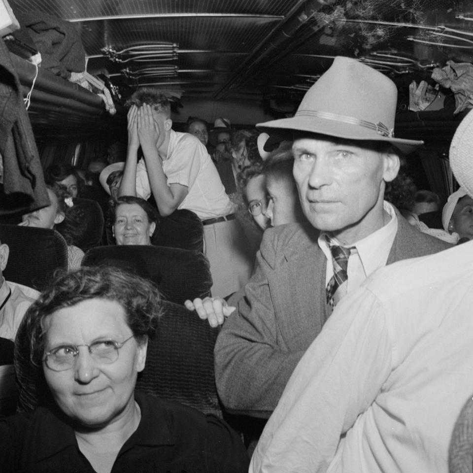  Passengers wait patiently to get off the bus after it arrives at the station