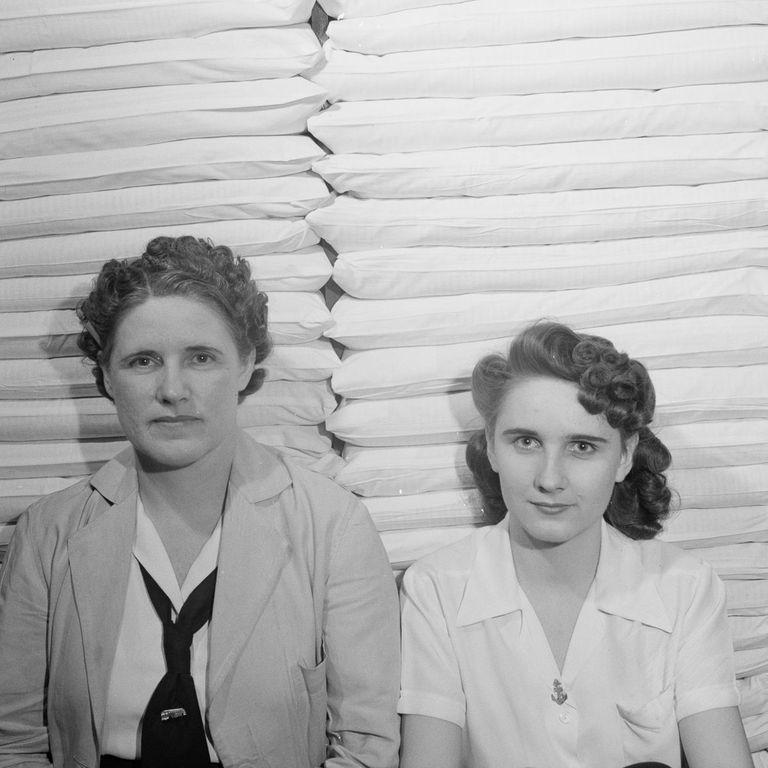  Staff working in the linen closet pose for a picture