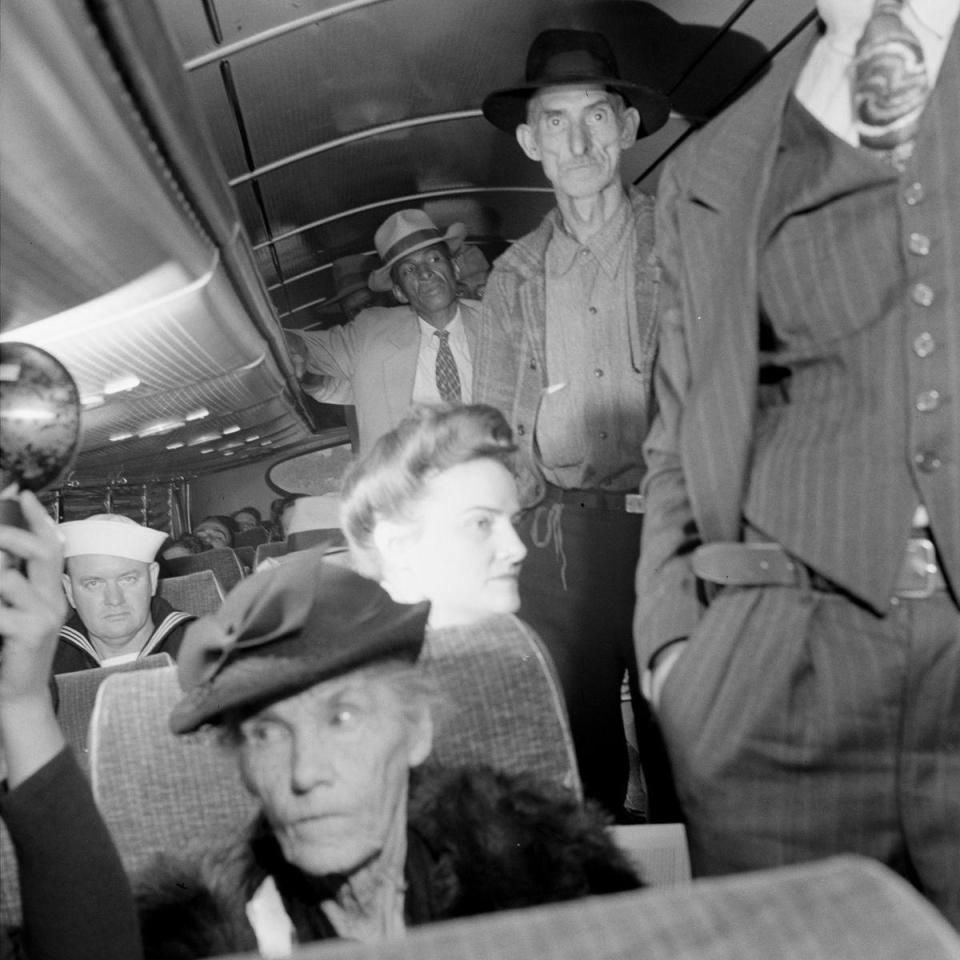  Passengers find their seats on a bus cross-country coach