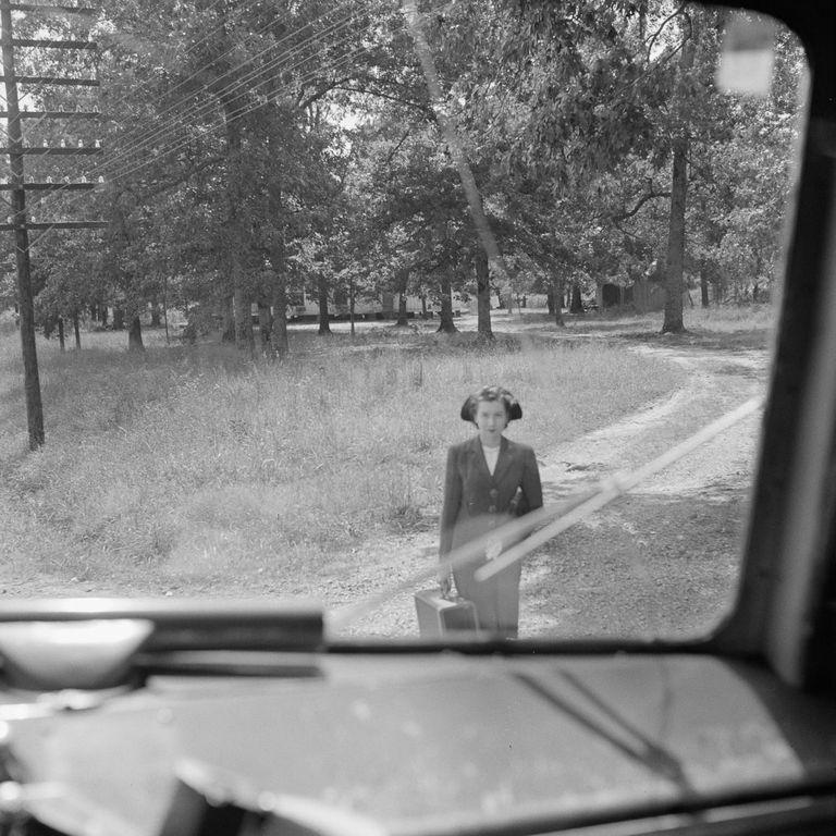  A young woman is seen watching the coach departing after arriving at her stop