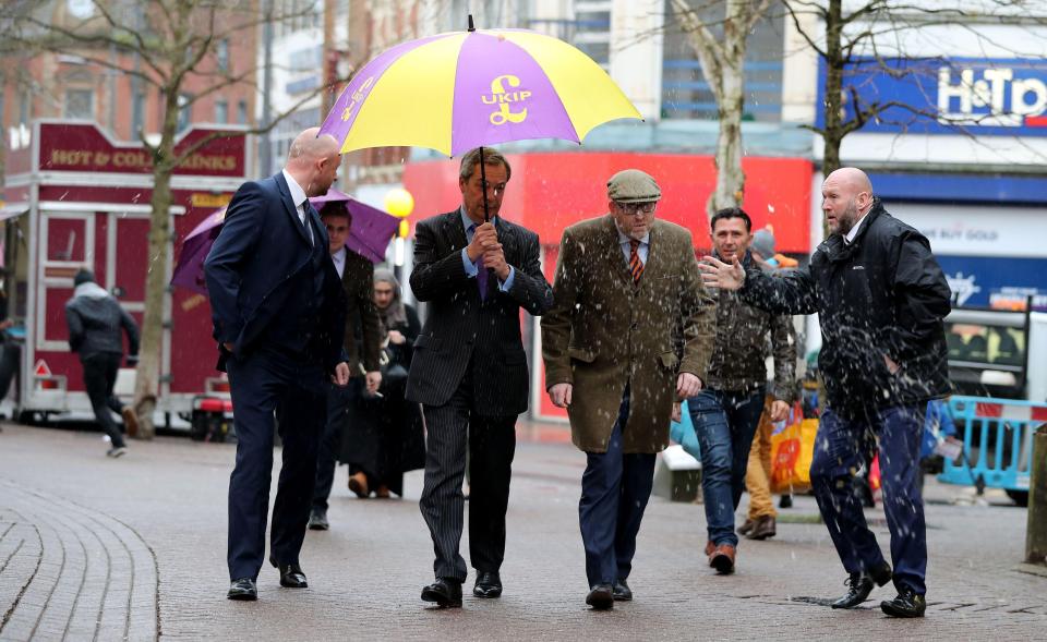  He was then seen running away from the scene after it hit the umbrella Mr Farage was holding