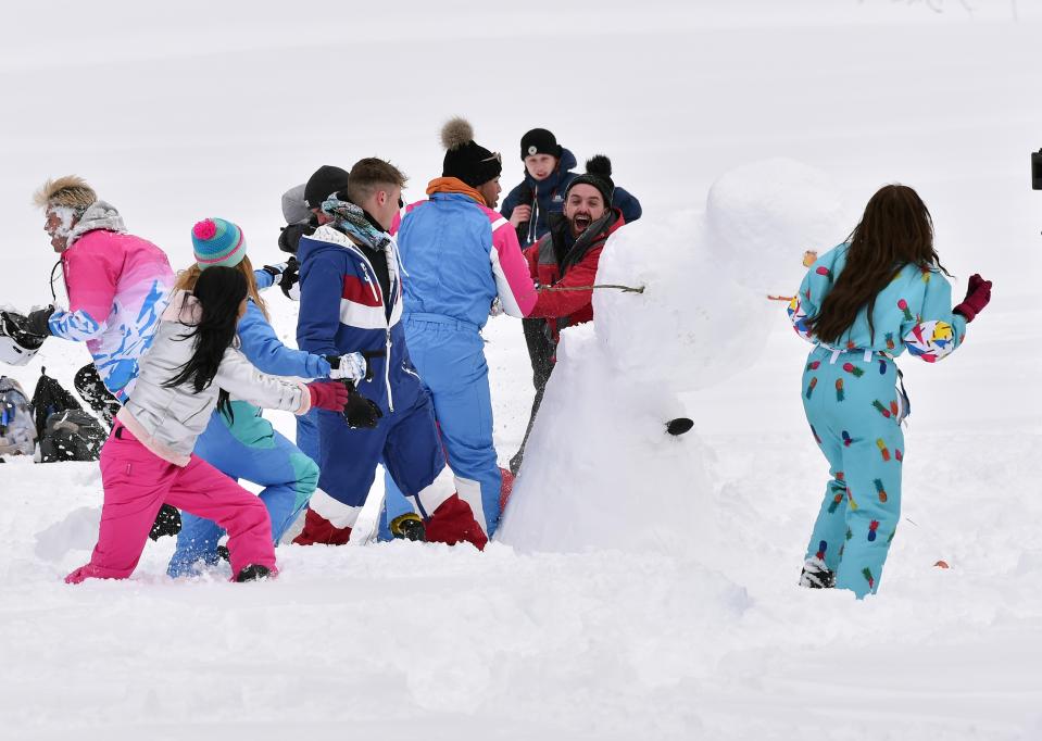  The were pictured playing happily in the snow