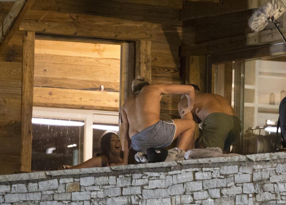  Marty wore a pair of blue and white swimming trunks for the late night dip