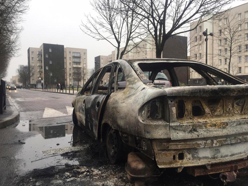  A burnt out car sat on the streets of north east Paris following the outbreak of violence on Monday night