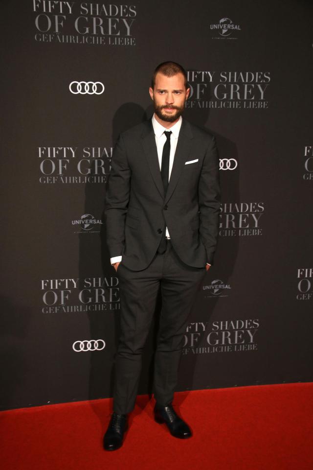  Jamie cut a dashing figure on the red carpet in a smart, dark grey suit