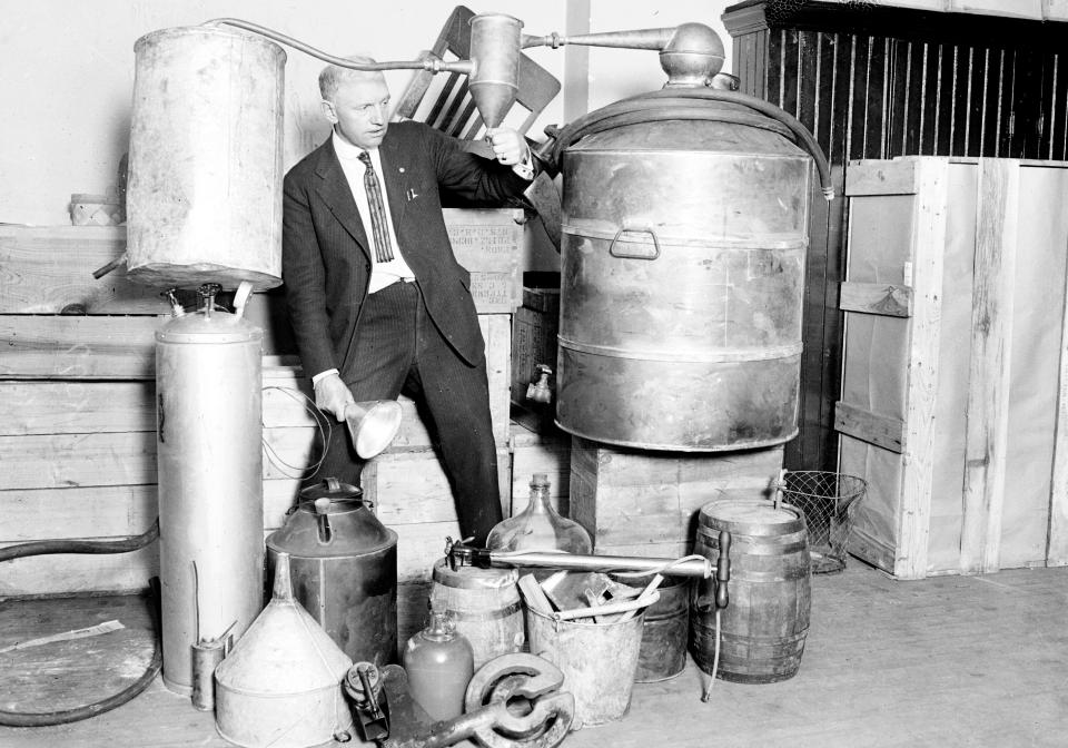  Alcohol, which was illegal during the Depression, is seized by police after it was discovered in a storage tank