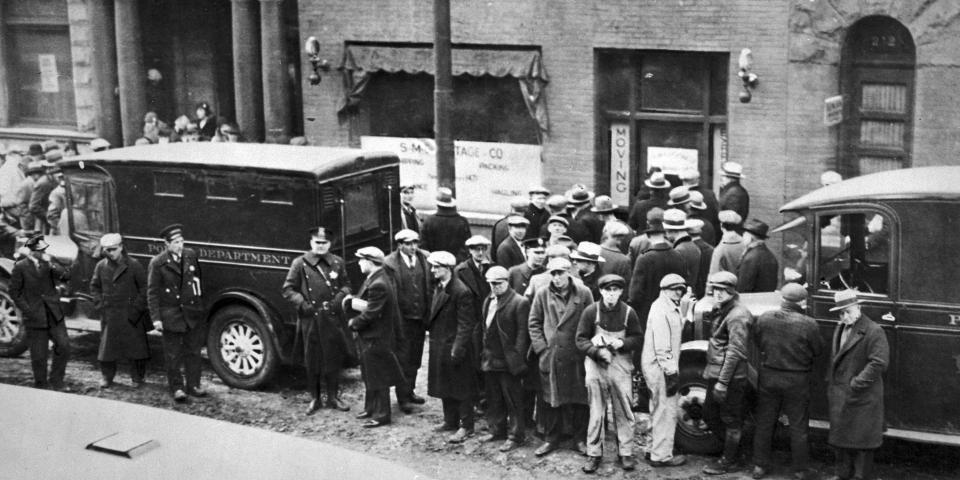  People gather in front of the infamous garage after the St Valentine's Day Massacre in 1929