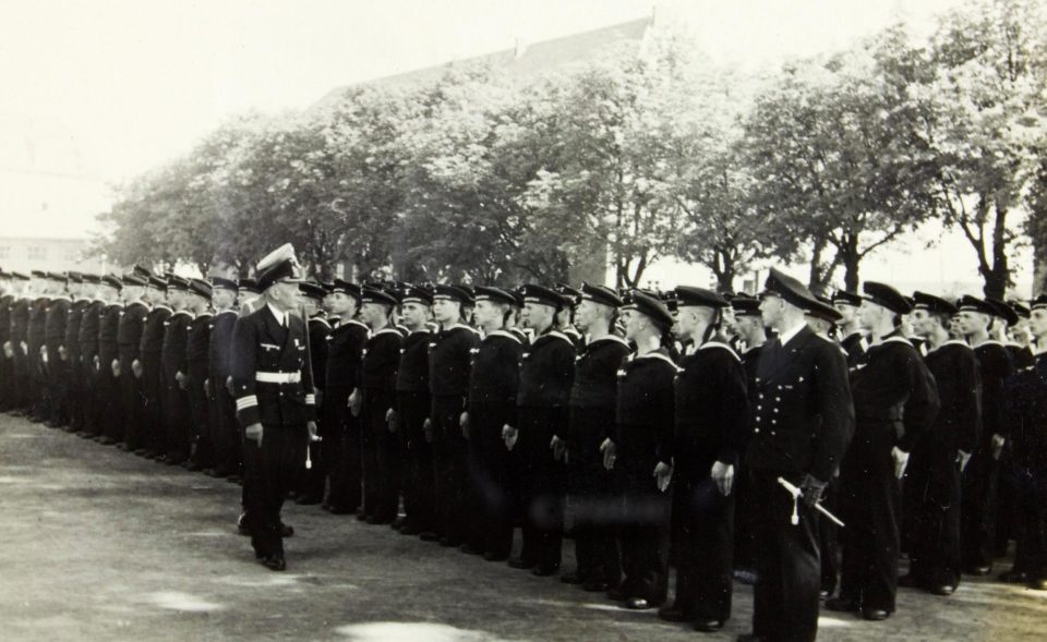  Crewmen stand for inspection at a parade